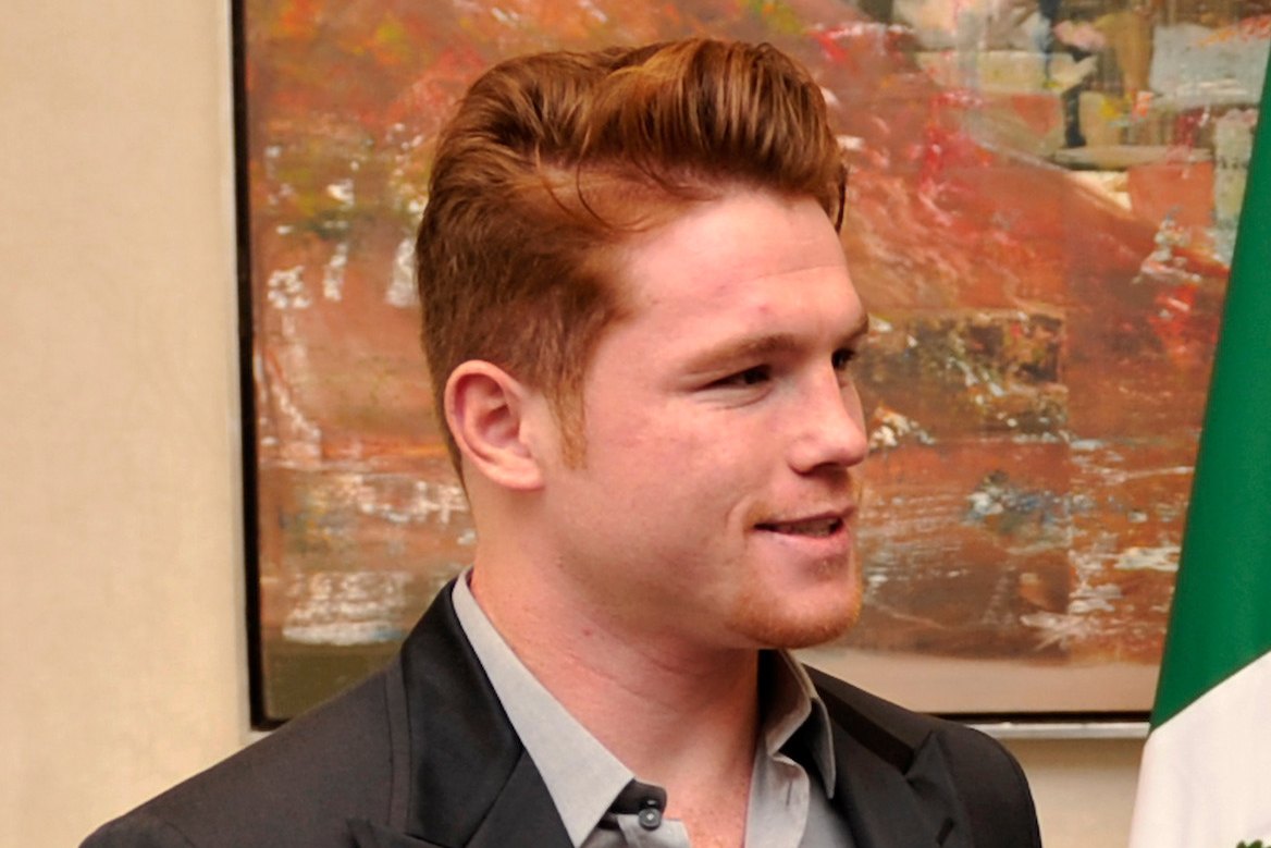 Canelo Álvarez in a suit and open-collar shirt, photographed in Mexico City in 2013