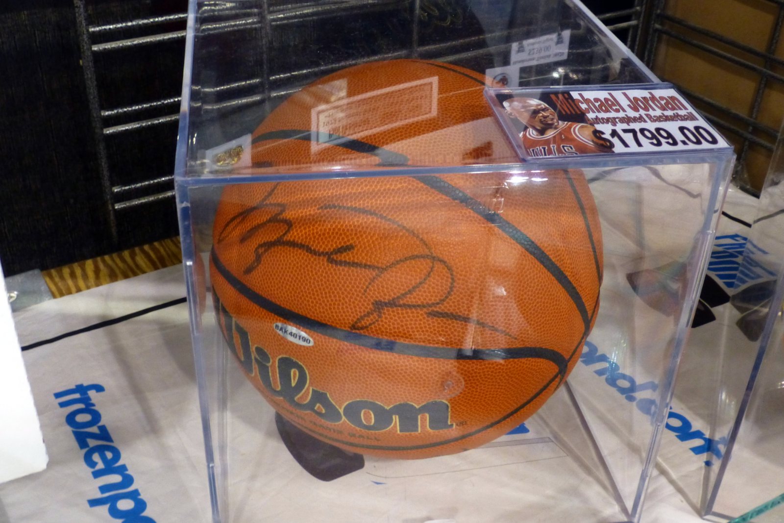 A Michael Jordan signed Wilson basketball in a display case with a $1,799 price tag
